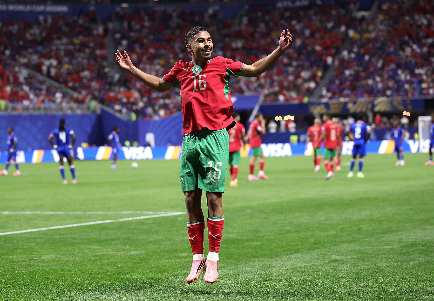Gessime Yassine of Morocco celebrates after scoring his team's fourth goal during the FIFA World Cup Gessime Yassine of Morocco celebrates after scoring his team's fourth goal during the FIFA World Cup